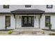 Elegant front door featuring glass inserts, flanked by windows and set against a charming brick facade at 3270 Brookview Dr, Marietta, GA 30068