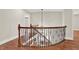 Second floor hallway featuring wood railing with iron spindles and recessed lighting at 3270 Brookview Dr, Marietta, GA 30068