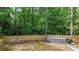 Backyard swim spa with chairs, wooded backdrop, and surrounding lawn at 3270 Brookview Dr, Marietta, GA 30068