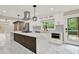 Modern kitchen with white cabinets, stainless appliances, large island, and view to deck at 3270 Brookview Dr, Marietta, GA 30068