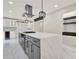 Modern kitchen with quartz countertops, stainless steel appliances, gas range, and a large island at 3270 Brookview Dr, Marietta, GA 30068