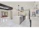 Modern kitchen with large island, stainless appliances, white cabinets, and marble countertops at 3270 Brookview Dr, Marietta, GA 30068