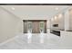 Bright living room with fireplace, stone accent wall, light-colored walls, and marble floors at 3270 Brookview Dr, Marietta, GA 30068
