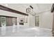 Bright living room with fireplace, stone accent wall, light-colored walls, and white marble floors at 3270 Brookview Dr, Marietta, GA 30068