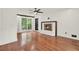 Bright living room featuring hardwood floors, a fireplace, and natural light at 3270 Brookview Dr, Marietta, GA 30068