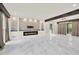 Spacious living room featuring a modern fireplace, large windows, and elegant marble floors and wooden beams at 3270 Brookview Dr, Marietta, GA 30068