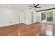 Bright main bedroom boasts hardwood floors, white trim, natural light, and an en-suite bathroom at 3270 Brookview Dr, Marietta, GA 30068
