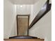 View of the stairwell featuring stained wooden steps leading to the lower level doorway at 3270 Brookview Dr, Marietta, GA 30068