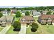 Beautiful aerial view of a brick home with a well-kept lawn, surrounded by mature trees in a friendly neighborhood at 532 Pelham Pl, Mcdonough, GA 30253