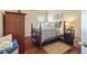 Cozy bedroom featuring hardwood floors, a stylish bed, and ample natural light at 532 Pelham Pl, Mcdonough, GA 30253