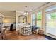 Charming breakfast nook with a built-in bench, hardwood floors, and view to the yard at 532 Pelham Pl, Mcdonough, GA 30253