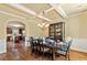 Formal dining room with coffered ceilings, hardwood floors, and stylish furniture, perfect for Gathering gatherings at 532 Pelham Pl, Mcdonough, GA 30253