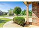 Well maintained front yard featuring manicured shrubs and green lawns, enhancing the home's curb appeal at 532 Pelham Pl, Mcdonough, GA 30253