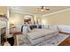 Inviting living room with an oversized sofa, fireplace, and open access to the kitchen at 532 Pelham Pl, Mcdonough, GA 30253
