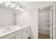 Bathroom featuring dual vanity, mirror, and tub shower combo at 5383 Heron Bay Blvd, Locust Grove, GA 30248
