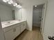 Modern bathroom features a double sink vanity with stylish fixtures and finishes at 5383 Heron Bay Blvd, Locust Grove, GA 30248