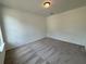Neutral bedroom featuring carpeted floors and a ceiling light at 5383 Heron Bay Blvd, Locust Grove, GA 30248