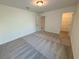 A cozy bedroom with neutral carpet and a closet, offering a blank canvas for personalization at 5383 Heron Bay Blvd, Locust Grove, GA 30248
