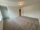 Cozy bedroom with soft carpeting and neutral walls, providing a comfortable ambiance at 5383 Heron Bay Blvd, Locust Grove, GA 30248