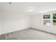 Bedroom featuring carpet flooring, natural light, and neutral paint at 5383 Heron Bay Blvd, Locust Grove, GA 30248