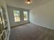 Bedroom with natural light, carpeted floors, and double windows at 5383 Heron Bay Blvd, Locust Grove, GA 30248