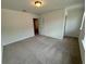 Comfortable bedroom with neutral walls, well-lit by overhead lighting at 5383 Heron Bay Blvd, Locust Grove, GA 30248