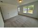 Inviting bedroom featuring ample natural light from its large windows at 5383 Heron Bay Blvd, Locust Grove, GA 30248