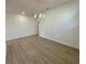 Dining room featuring laminate floors, and a chandelier at 5383 Heron Bay Blvd, Locust Grove, GA 30248