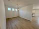 Dining room featuring laminate floors, and a chandelier at 5383 Heron Bay Blvd, Locust Grove, GA 30248