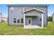 Home's backyard featuring a covered patio perfect for outdoor entertaining and relaxation at 5383 Heron Bay Blvd, Locust Grove, GA 30248
