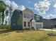 Charming two-story home with a combination brick and siding exterior, attached garage, and nice landscaping at 5383 Heron Bay Blvd, Locust Grove, GA 30248