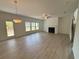 Spacious living room with laminate flooring, a fireplace, and lots of natural light at 5383 Heron Bay Blvd, Locust Grove, GA 30248