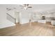 Open floor plan showing kitchen, stairs and living room with hardwood floors at 5383 Heron Bay Blvd, Locust Grove, GA 30248