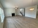 Spacious living room featuring a fireplace, ceiling fan, and stairs leading to the upper level at 5383 Heron Bay Blvd, Locust Grove, GA 30248