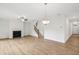 Living room with fireplace and chandelier at 5383 Heron Bay Blvd, Locust Grove, GA 30248