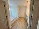 Bright bathroom featuring a bathtub, and a large closet to the right side at 5383 Heron Bay Blvd, Locust Grove, GA 30248