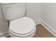Modern toilet situated in a private location with wood look flooring at 5383 Heron Bay Blvd, Locust Grove, GA 30248