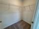Small walk-in closet with built in shelving at 5383 Heron Bay Blvd, Locust Grove, GA 30248
