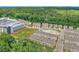 Wide aerial view captures a vibrant neighborhood with diverse housing options near commercial areas and green spaces at 613 Harrington Hls, Decatur, GA 30032