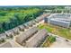 Expansive aerial view showcases a neighborhood surrounded by lush greenery with convenient access to commercial buildings at 613 Harrington Hls, Decatur, GA 30032
