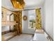Bright bedroom with unique light fixture, wood bunk beds, stylish mirror and colorful yellow floral curtains at 613 Harrington Hls, Decatur, GA 30032