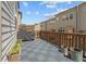 Spacious outdoor deck with gray flooring tiles and a wooden privacy fence at 613 Harrington Hls, Decatur, GA 30032