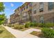 Brick townhome exterior with manicured landscaping and private entries at 613 Harrington Hls, Decatur, GA 30032