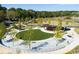 Well-maintained public park with green spaces, stage, and walking paths at 613 Harrington Hls, Decatur, GA 30032