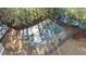 Aerial view of the community basketball court surrounded by mature trees and a well maintained landscape at 6355 Marlow Dr, Cumming, GA 30041