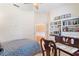 Bright bedroom with built-in bookshelves and charming desk, featuring hardwood floors at 6355 Marlow Dr, Cumming, GA 30041