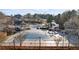 Large community pool with slide, cabanas, and seating areas at 6355 Marlow Dr, Cumming, GA 30041
