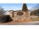 Stone entrance sign to Muirfield at Windermere welcomes residents and guests at 6355 Marlow Dr, Cumming, GA 30041