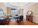 Elegant dining room with hardwood floors, chandelier lighting, and classic decor at 6355 Marlow Dr, Cumming, GA 30041