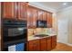 Well-equipped kitchen featuring wood cabinets, stainless steel appliances, and ample counter space at 6355 Marlow Dr, Cumming, GA 30041